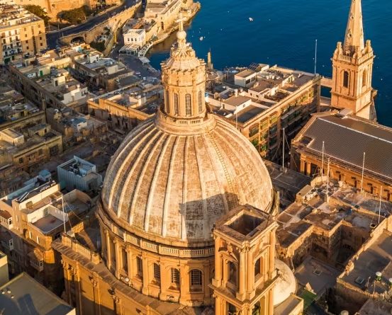The great dome of the Carmelite church rising over the capital’s rooftops